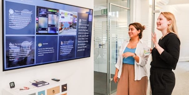 staff loking at tv in office